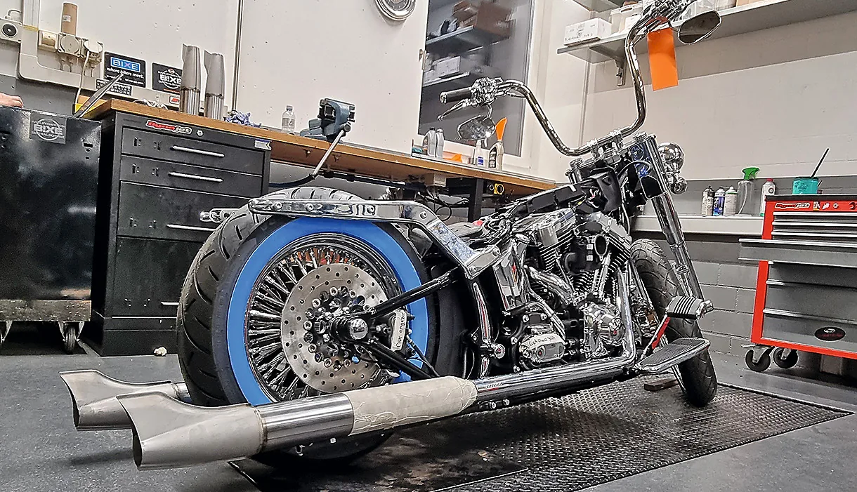 Left and right, various exhaust parts and fishtail end caps. Centre: the bare build of the complete exhaust system.
