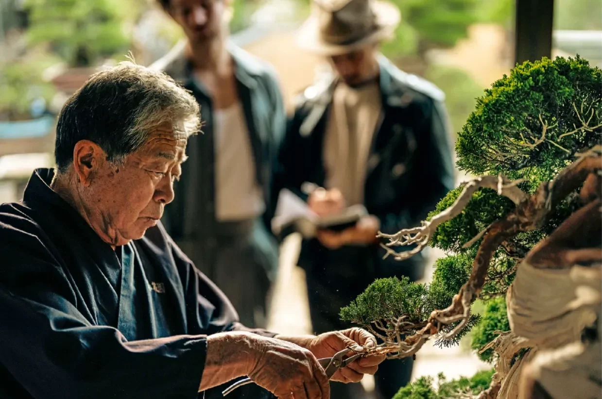 Bonsai master Kunio Kobayashi, 76, in his famous Tokyo garden – Eric Blum and Luca Meyer look on. Photo: Bon Parinya Wongwannawat / Vesa Eskola