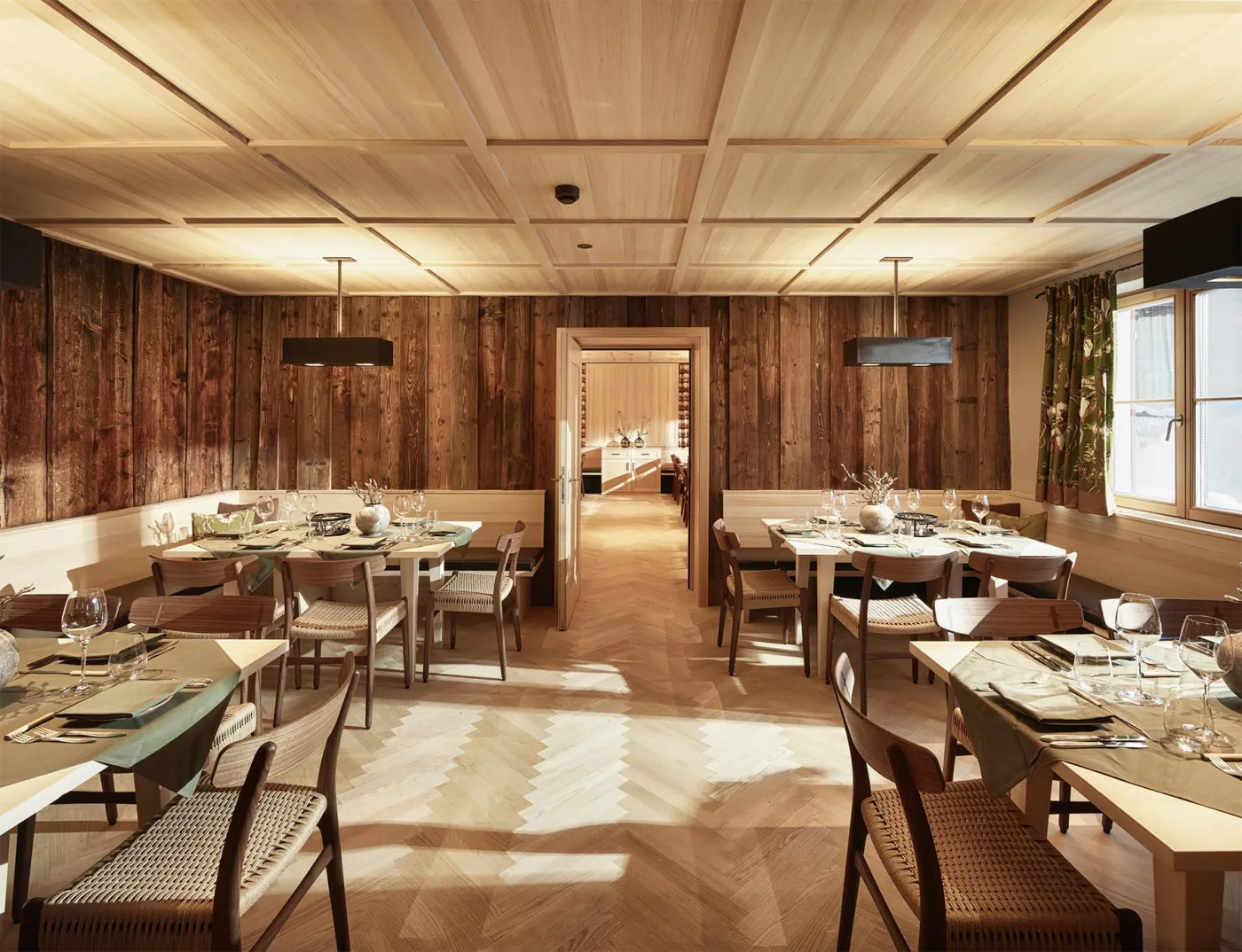 After the menu: cosy lounges and a spacious spa with a view of the 2,704-metre Rote Wand.