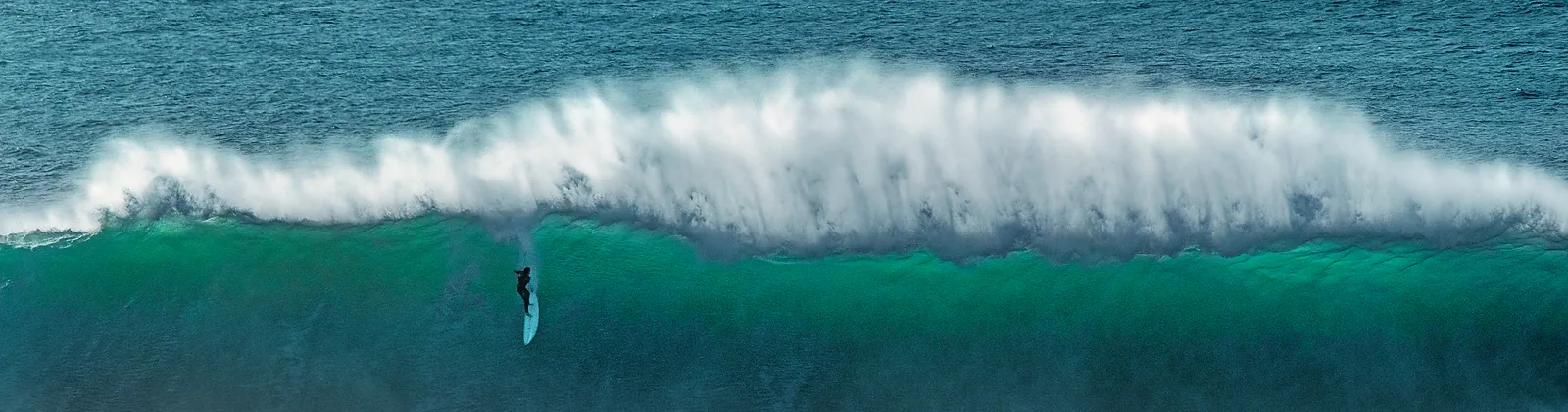 Big-wave surfing means climbing a wall of water by physical strength alone – the waves reach the height of six-storey buildings.